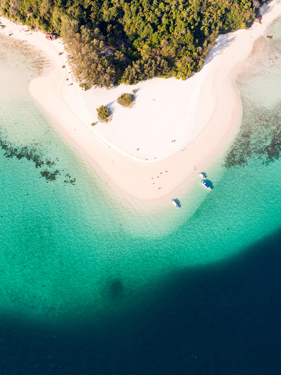 Turquoise water meeting a coastal island