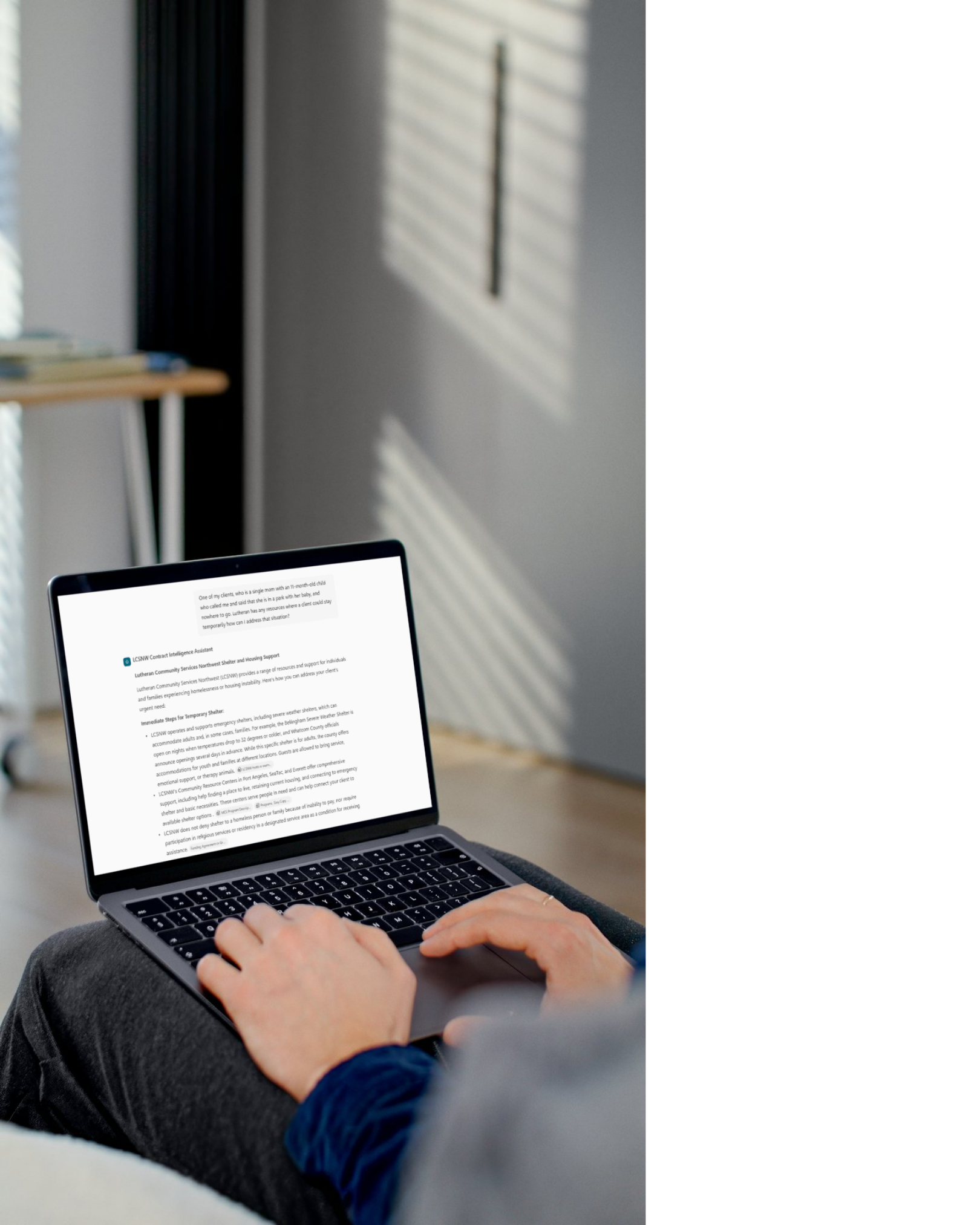 Laptop displaying the LCSNW Contract Intelligence Assistant’s housing-support response, from the presentation